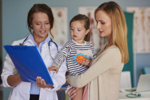 Visit to the doctor office little girl with mom